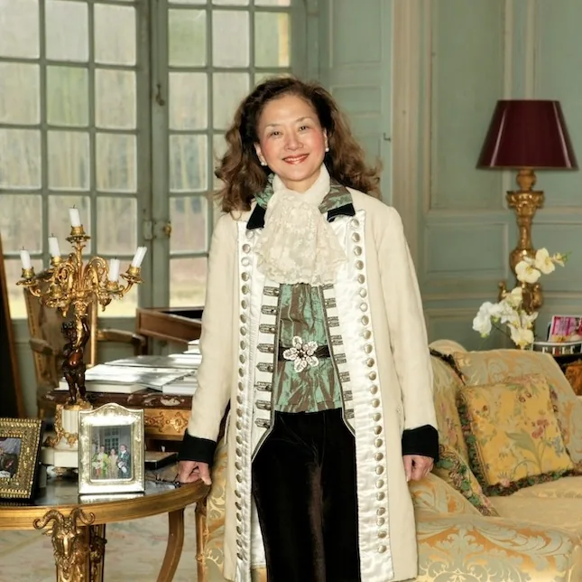 Olivia Hsu Decker standing in a paneled salon at Château de Villette, France
